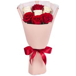 Red and white roses in the bouquet 
