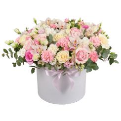 Roses and orchids in a round box 